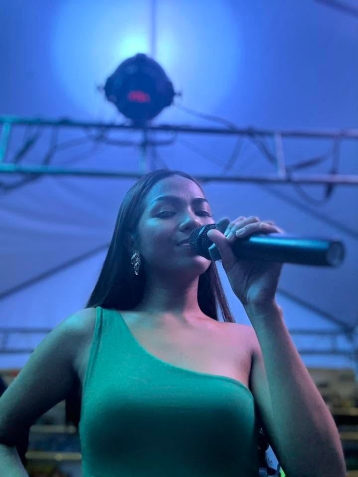 Jessa Coral performing at an outdoor festival